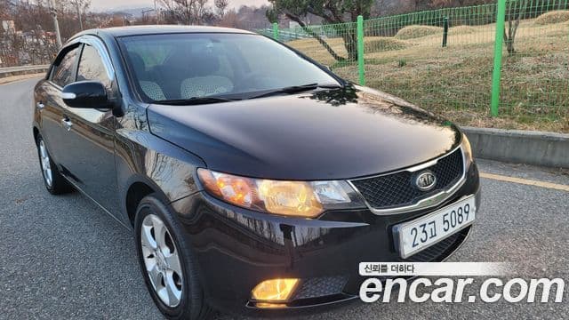 Kia Forte чёрный, 2010 3